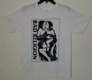 A white t-shirt featuring the "Nuns Kissing" graphic from the punk rock band Bad Religion. The bold design captures the rebellious spirit of the band, showcasing iconic imagery. Made from 100% cotton for a soft, breathable feel, this shirt is available in unisex sizes from Small to 2XL, perfect for punk rock enthusiasts and those who appreciate edgy, statement-making fashion.