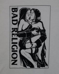 A white t-shirt featuring the "Nuns Kissing" graphic from the punk rock band Bad Religion. The bold design captures the rebellious spirit of the band, showcasing iconic imagery. Made from 100% cotton for a soft, breathable feel, this shirt is available in unisex sizes from Small to 2XL, perfect for punk rock enthusiasts and those who appreciate edgy, statement-making fashion.