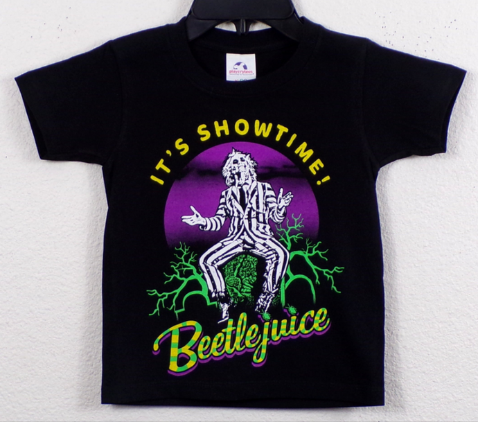 Youth-sized Beetlejuice – It's Showtime! T-shirt featuring a bold silkscreen graphic of Beetlejuice in his iconic striped suit, with the phrase 'It’s Showtime!' printed underneath. Available in sizes XS - XL, perfect for young fans of the cult classic film.