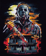 Load image into Gallery viewer, Michael Myers from the Halloween series, featuring his iconic mask and a sinister expression. The design is bold and striking, with red tones that stand out against the dark background. Perfect for horror fans, this youth-sized shirt combines spookiness and style. Available in XS-XL
